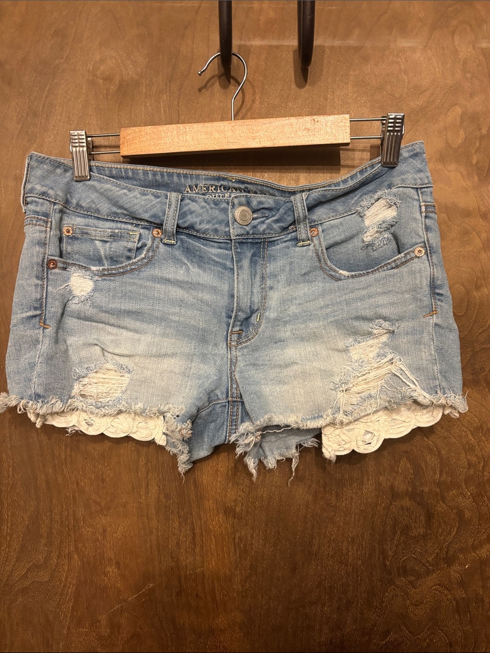 American Eagle Outfitters Faded Blue Distressed Denim Shorts with Lace Trim